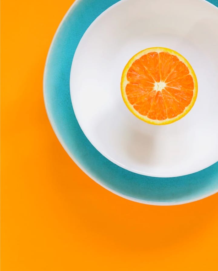 an orange slice on a plate